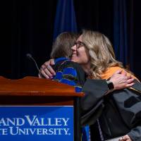 Faculty hugging
